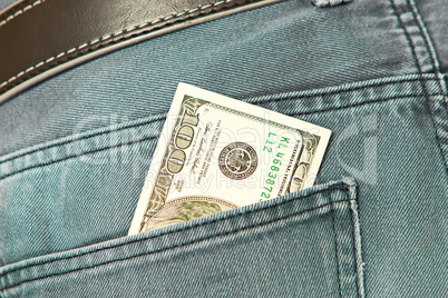 American dollar bills in jeans pocket background