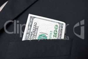 United States dollar (USD) bills - in businessman suit pocket