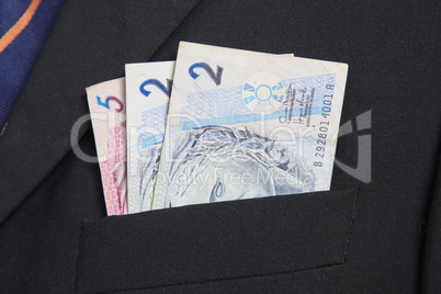 Brazilian Real in the pocket of a suit
