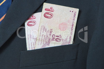 Turkish Lira in the pocket of a suit