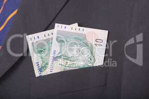 South african Rands in the pocket of a suit