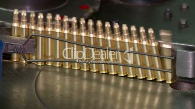 Ammunition factory , bullets for rifle on production line