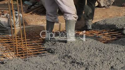 Concrete pouring works, compacting liquid cement