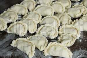 Dumplings on the dark kitchen board