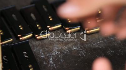 Soldier preparing ammunition for gun