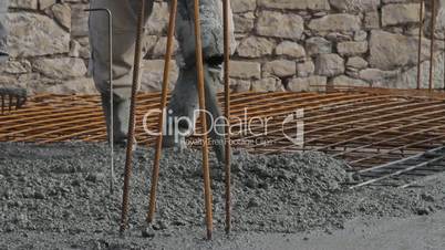 Concrete pouring works, compacting liquid cement