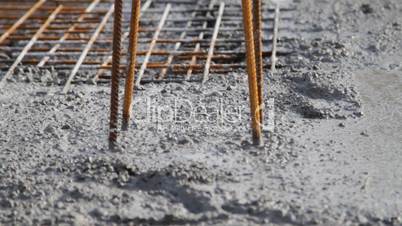 Spreading concrete, compacting liquid cement