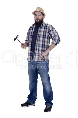 Bearded man with garden tools