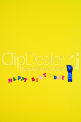 Abstract yellow background with an inscription happy birthday