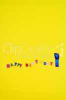 Abstract yellow background with an inscription happy birthday