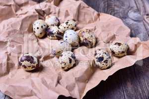 Fresh quail eggs on brown paper