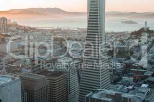 Sunset over Telegraph Hill, Alcatraz Island and San Francisco Bay from the Financial District.