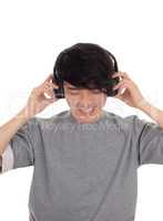 Asian man listen to music.