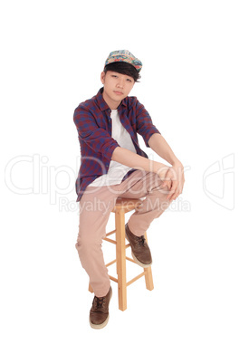 Asian man sitting and relaxing.