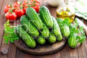 Fresh cucumbers on wooden table