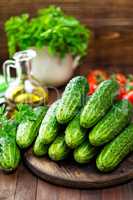 Fresh cucumbers on wooden table