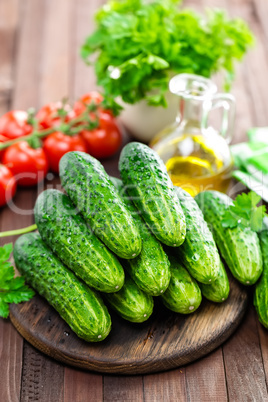 Fresh cucumbers on wooden table