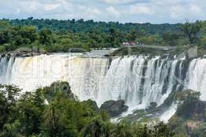 Spectators on observation deck watching Iguazu Falls