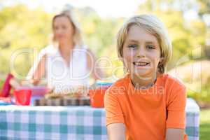 Boy smiling at camera in park