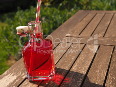 Red juice on a garden table
