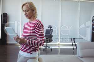 Entrepreneur using digital tablet at office