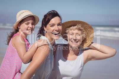 Portrait of cheerful multi-generation family at beach