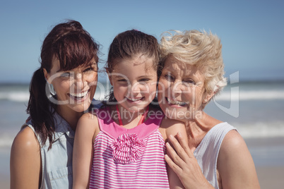 Portrait of happy multi-generation family at beach