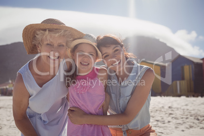 Portrait of smiling multi-generation family at beach