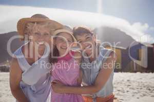 Portrait of smiling multi-generation family at beach