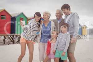 Cheerful multi-generation family taking selfie