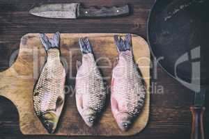 Fish carp on a kitchen cutting board