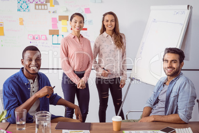 Portrait of business people working at office