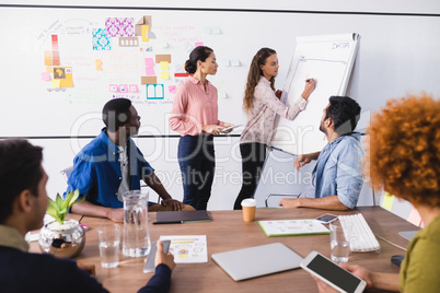 Business people discussing while working in office