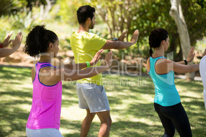 Group of people exercising in the park