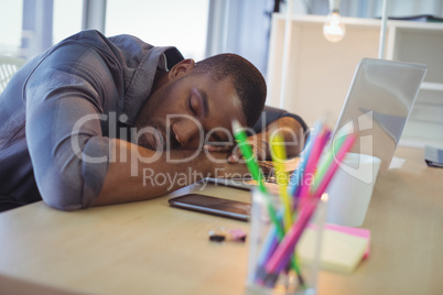 Tired businessman napping in office