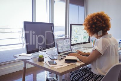 Focused businesswoman working in office