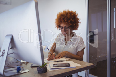 Young businesswoman working in office