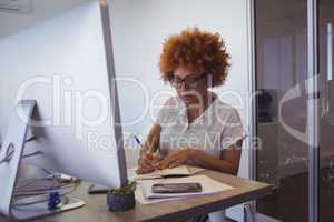 Young businesswoman working in office