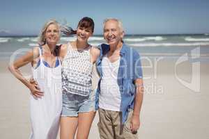 Portrait of family standing at beach