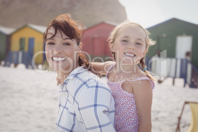 Portrait of smiling woman with daughter