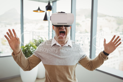 Happy executive using virtual reality headset