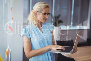 Attentive executive using laptop