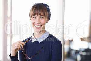 Portrait of cheerful businesswoman in office