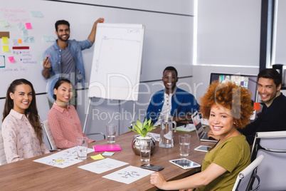 Portrait of business people sitting at table