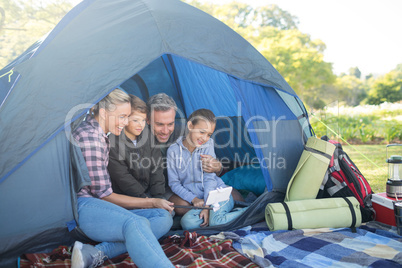 Family taking a selfie in the tent