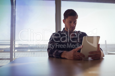 Businessman using digital table at office