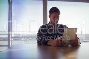 Businessman using digital table at office