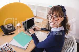 High angle portrait of businesswoman working in office