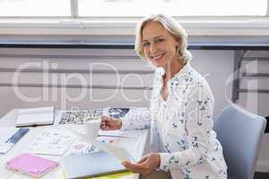 Portrait of businesswoman working in creative office