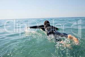 Surfer surfing in the sea